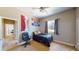 Bedroom with a dark bed, ceiling fan and window at 6198 Linneal Beach Dr, Apopka, FL 32703