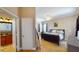 Cozy bedroom with neutral tones, a ceiling fan, and an ensuite bathroom at 6198 Linneal Beach Dr, Apopka, FL 32703