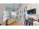 Open kitchen boasts white cabinetry, a breakfast bar, and stainless steel appliances for a modern touch at 6198 Linneal Beach Dr, Apopka, FL 32703