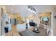 Open-concept living area with modern kitchen, dining area, and cozy living room at 6198 Linneal Beach Dr, Apopka, FL 32703