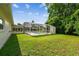 Enjoy outdoor living in this backyard featuring a screened-in pool at 620 Marshall St, Altamonte Springs, FL 32701