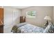 Bright bedroom with a window, a closet and a floral bedspread, offering a comfortable and inviting space at 620 Marshall St, Altamonte Springs, FL 32701