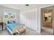 Bedroom featuring twin bed, closet, and neutral walls, providing ample storage and natural light at 620 Marshall St, Altamonte Springs, FL 32701