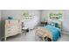 Sunlit bedroom with twin beds, a chest of drawers and two bright windows with views, creating a cozy atmosphere at 620 Marshall St, Altamonte Springs, FL 32701