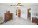 Spacious bedroom with a ceiling fan, a dresser and an open closet, providing ample space for your needs at 620 Marshall St, Altamonte Springs, FL 32701
