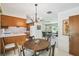 A round table and chairs in a dining room connecting to the kitchen and living room at 620 Marshall St, Altamonte Springs, FL 32701