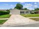 Well-maintained single story home with a spacious driveway and lush front lawn at 620 Marshall St, Altamonte Springs, FL 32701