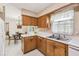 Kitchen featuring a window, white countertops and classic cabinets at 620 Marshall St, Altamonte Springs, FL 32701