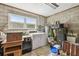 A rustic laundry room with washer, dryer, and storage shelves at 620 Marshall St, Altamonte Springs, FL 32701