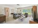 Cozy living room with a large window, comfortable seating, and neutral decor at 620 Marshall St, Altamonte Springs, FL 32701