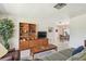 Open-concept living room with a view of the dining area and ample natural light at 620 Marshall St, Altamonte Springs, FL 32701