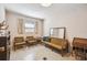 Bright living room featuring two chairs, a couch, and natural light at 620 Marshall St, Altamonte Springs, FL 32701