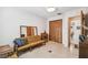 Cozy living area with a comfortable couch, desk, and ample closet space at 620 Marshall St, Altamonte Springs, FL 32701