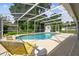 A screened-in pool with lounge chairs offers a relaxing outdoor experience at 620 Marshall St, Altamonte Springs, FL 32701