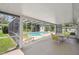 Covered patio with a view of the screened-in pool area, perfect for outdoor living at 620 Marshall St, Altamonte Springs, FL 32701