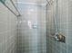 Tiled shower in light blue color featuring shower-head and a soap holder at 620 Marshall St, Altamonte Springs, FL 32701