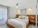 Bright bedroom featuring a ceiling fan, and warm wood accents at 620 Wood Dr, Kissimmee, FL 34759