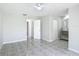 Bright bedroom with en-suite bathroom featuring tile floors and walk-in closet at 620 Wood Dr, Kissimmee, FL 34759