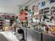Organized garage with tools on pegboard, shelves with bins, and ample workspace at 620 Wood Dr, Kissimmee, FL 34759