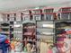 Garage storage with shelves of model cars and containers, maximizing organization and display at 620 Wood Dr, Kissimmee, FL 34759