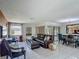 Bright living room with tile floors, comfortable seating, and sliding glass doors at 620 Wood Dr, Kissimmee, FL 34759
