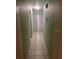 A tiled hallway, painted with a light green hue, adds character to the interior at 6251 Bolling Dr, Orlando, FL 32808