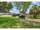 Enjoy the spacious backyard, a pergola, and serene outdoor living, perfect for relaxation and entertainment at 660 6Th St, Daytona Beach, FL 32117