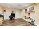 Basement with wood-look vinyl flooring, recessed lighting, and ample space for recreation at 660 6Th St, Daytona Beach, FL 32117