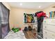 Bedroom features an unmade bed with a window, a dresser and personal items at 660 6Th St, Daytona Beach, FL 32117