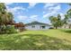 Charming home exterior featuring a well-maintained lawn, blue siding and space for parking at 660 6Th St, Daytona Beach, FL 32117