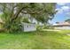 Backyard shed surrounded by lush greenery, offering storage space at 660 6Th St, Daytona Beach, FL 32117
