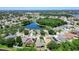 Beautiful aerial view showcases neighborhood homes surrounding a scenic pond and lush greenery at 6843 Cherry Grove Cir, Orlando, FL 32809