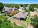 From above, a backyard with a fence, green landscape and well-kept yard is showcased at 6843 Cherry Grove Cir, Orlando, FL 32809