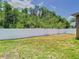 The home's fenced backyard offers a secure outdoor living space at 6843 Cherry Grove Cir, Orlando, FL 32809