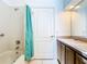 Bathroom featuring double sinks, tub and tiled floors, enhancing the home's appeal at 6843 Cherry Grove Cir, Orlando, FL 32809