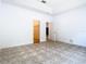 An airy room featuring neutral paint and attractive flooring at 6843 Cherry Grove Cir, Orlando, FL 32809