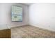 Bright bedroom with a large window providing natural light and a neutral color palette at 6843 Cherry Grove Cir, Orlando, FL 32809
