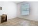 Bedroom with neutral walls, tile floors, a desk and a well lit window at 6843 Cherry Grove Cir, Orlando, FL 32809