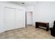 This spacious bedroom has tile floors, closet with sliding doors and a door to another room at 6843 Cherry Grove Cir, Orlando, FL 32809