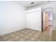 Bedroom includes closet with sliding doors and an arched doorway visible to the next room at 6843 Cherry Grove Cir, Orlando, FL 32809