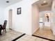 Spacious hallway featuring tiled flooring, neutral walls, and a view into multiple rooms through arched doorways at 6843 Cherry Grove Cir, Orlando, FL 32809