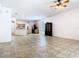 Open-concept living space with tile flooring, fan and eat-in kitchen at 6843 Cherry Grove Cir, Orlando, FL 32809