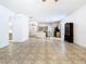 Open-concept living space with tile flooring, fan and eat-in kitchen at 6843 Cherry Grove Cir, Orlando, FL 32809