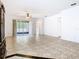 Spacious living room with sliding glass doors leading to the outdoor patio at 6843 Cherry Grove Cir, Orlando, FL 32809