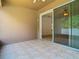 Cozy screened patio with a ceiling fan and access to backyard, perfect for relaxing and entertaining at 6843 Cherry Grove Cir, Orlando, FL 32809