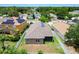 Aerial view displaying a home's backyard, screened in porch, and perimeter fence at 6843 Cherry Grove Cir, Orlando, FL 32809