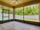 Enjoy this screened porch overlooking the lush backyard at 6843 Cherry Grove Cir, Orlando, FL 32809