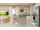 Bright and open floor plan with modern kitchen, stainless refrigerator, and living room at 7183 Rosy Sky Ave, Orlando, FL 32829