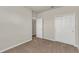 Bedroom features neutral walls, carpet flooring, and closet, offering a versatile living space at 8230 Corkfield Ave, Orlando, FL 32832