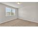 Neutral bedroom featuring carpeted floors, and windows that let in natural light at 8230 Corkfield Ave, Orlando, FL 32832